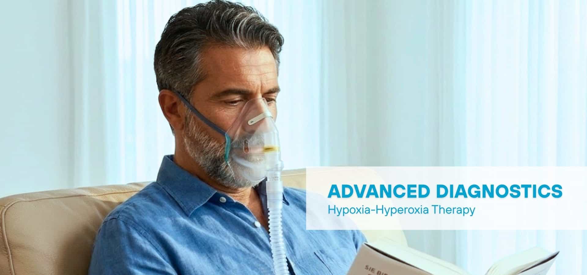Middle-aged man receiving hypoxia-hyperoxia therapy, wearing an oxygen mask while sitting comfortably and reading, with advanced diagnostics text overlay.