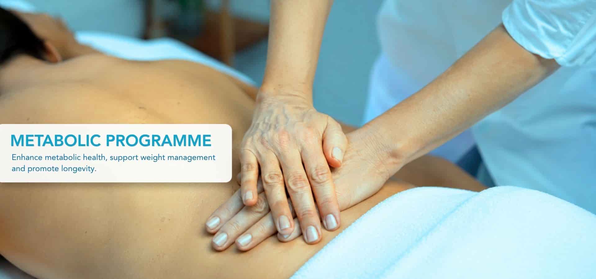 Close-up of a wellness therapy session with a therapist performing a back treatment as part of a metabolic health and longevity programme.