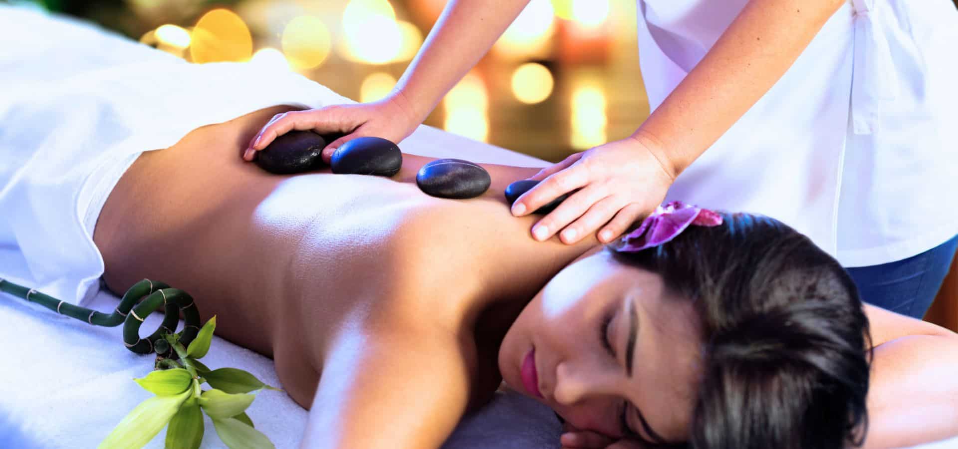 Luxury spa retreat hot stone massage therapy for deep relaxation and wellness